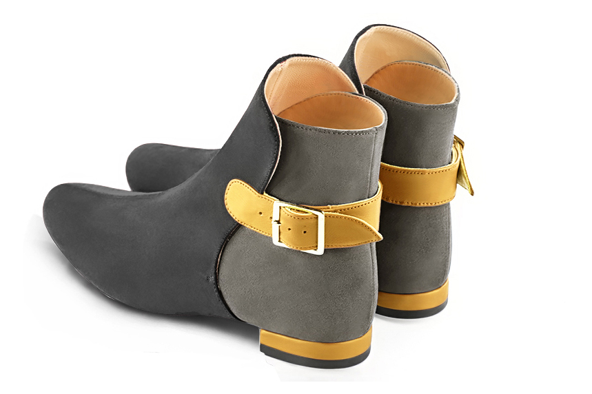 Dark grey and mustard yellow women's ankle boots with buckles at the back. Round toe. Flat block heels. Rear view - Florence KOOIJMAN